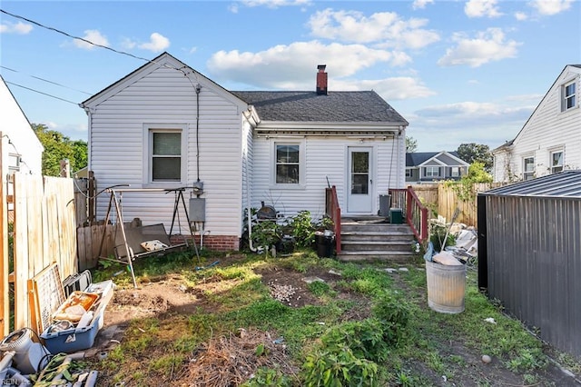 6459 Clare Rd, Norfolk, VA 23513 - back of property featuring a chimney, a fenced backyard, and roof with shingles