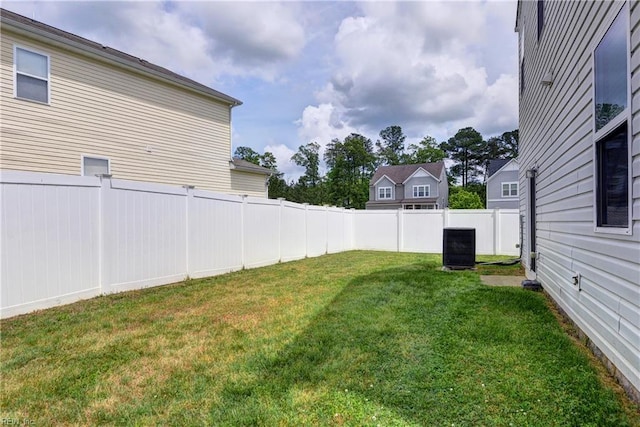 view of yard with central AC unit