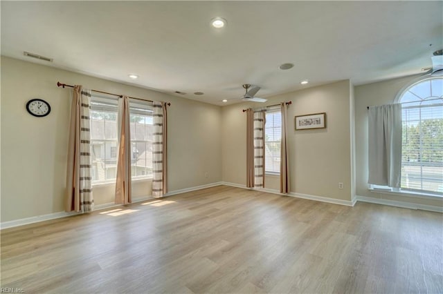 unfurnished room with light wood-style floors, recessed lighting, a ceiling fan, and baseboards
