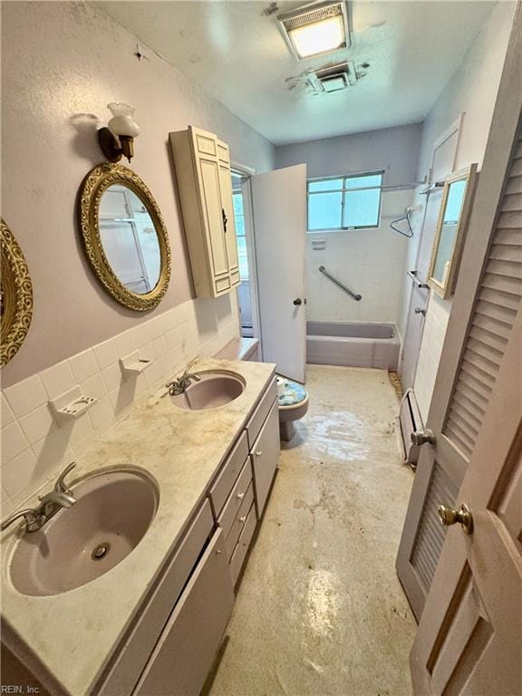 bathroom featuring shower / tub combination, double vanity, toilet, and backsplash
