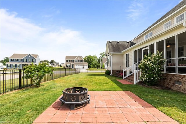 110 Lands End Dr, Elizabeth City, NC 27909 - view of yard featuring a fire pit, a patio, a residential view, and a sunroom