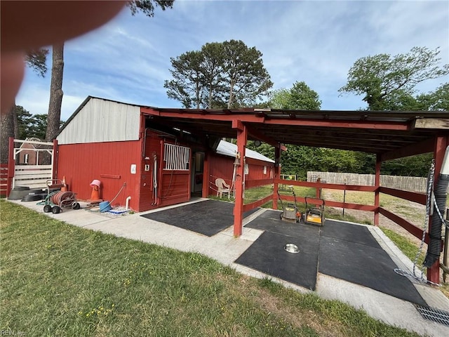 view of patio with an outdoor structure and an exterior structure