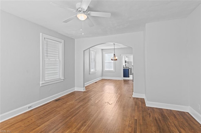 819 Lincoln St, Portsmouth, VA 23704 - unfurnished room with arched walkways, wood finished floors, baseboards, and a chandelier