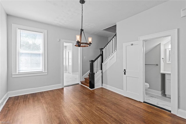 819 Lincoln St, Portsmouth, VA 23704 - entryway featuring a chandelier, wood finished floors, stairway, and baseboards