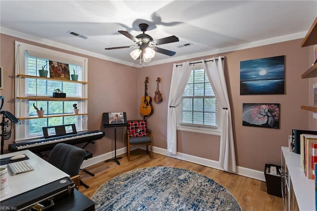 office space with ceiling fan, baseboards, crown molding, and wood finished floors