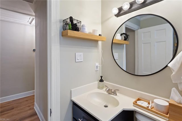 bathroom featuring vanity and wood finished floors