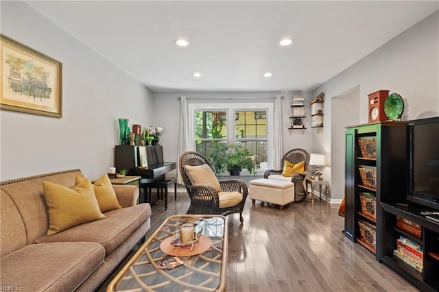 living area featuring wood finished floors and recessed lighting