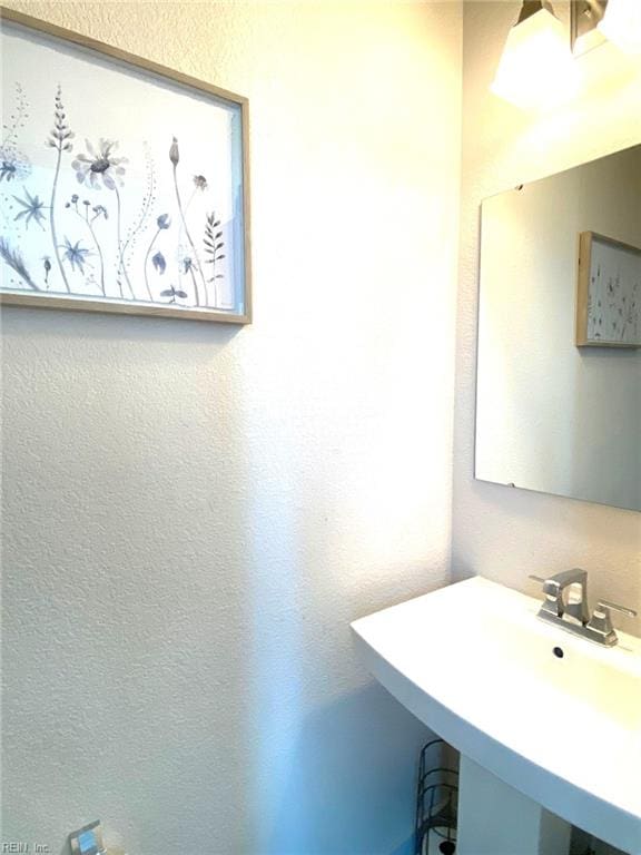 1011 Gabion Way, Chesapeake, VA 23323 - bathroom featuring a sink and a textured wall