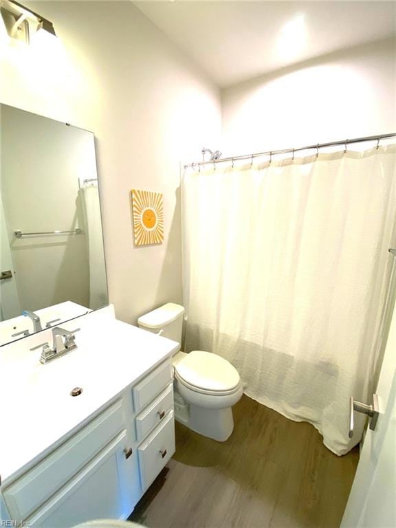 1011 Gabion Way, Chesapeake, VA 23323 - bathroom with wood finished floors, toilet, and vanity