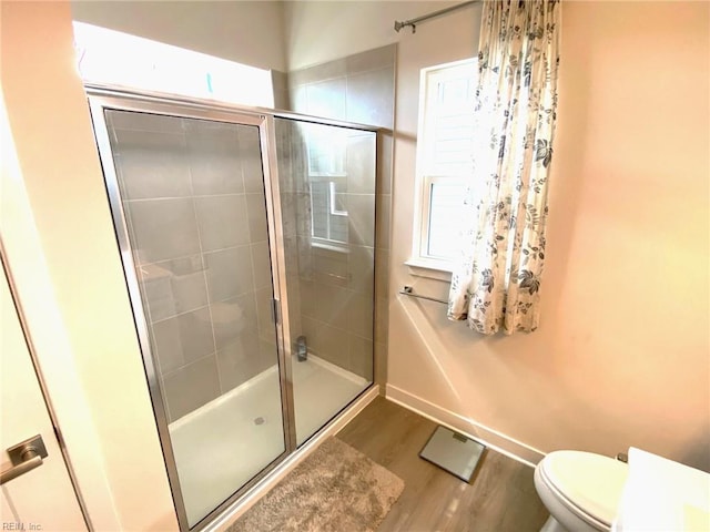 1011 Gabion Way, Chesapeake, VA 23323 - full bath with a shower stall, wood finished floors, toilet, and baseboards