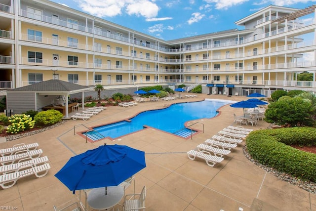 community pool featuring a patio area and a gazebo