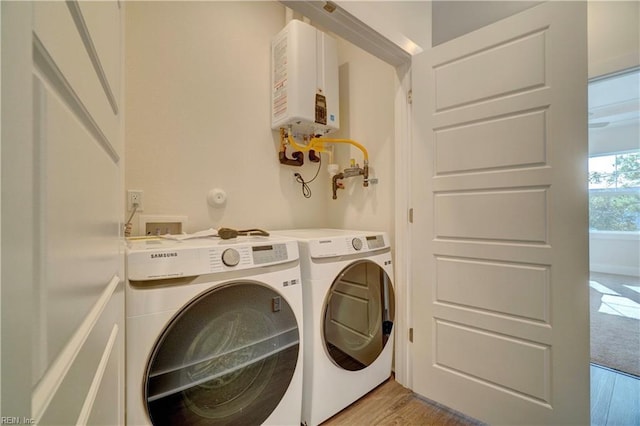 2919 Pretty Lake Ave, Norfolk, VA 23518 - clothes washing area featuring water heater, independent washer and dryer, and light wood-style floors