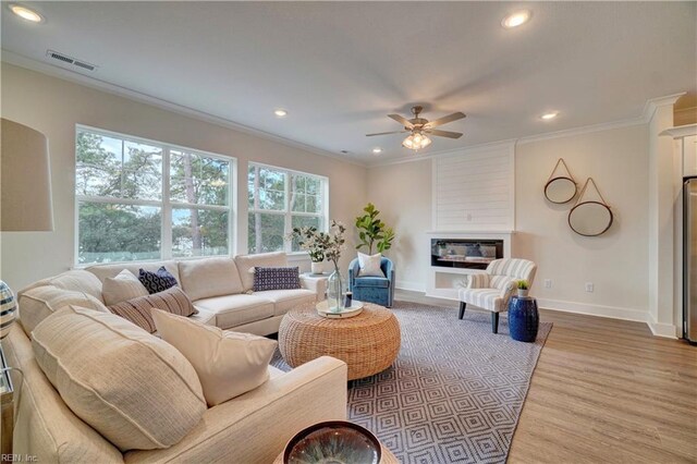 2919 Pretty Lake Ave, Norfolk, VA 23518 - living room with ornamental molding, plenty of natural light, recessed lighting, baseboards, and light wood-type flooring