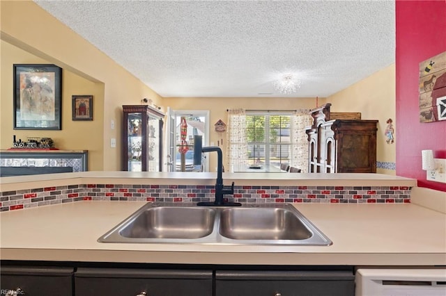 1005 Villas Ct, Virginia Beach, VA 23456 - kitchen featuring a sink, a textured ceiling, light countertops, and dishwasher