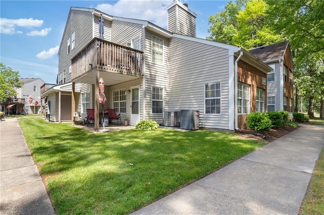 1005 Villas Ct, Virginia Beach, VA 23456 - back of house featuring a chimney, a yard, a patio, and cooling unit