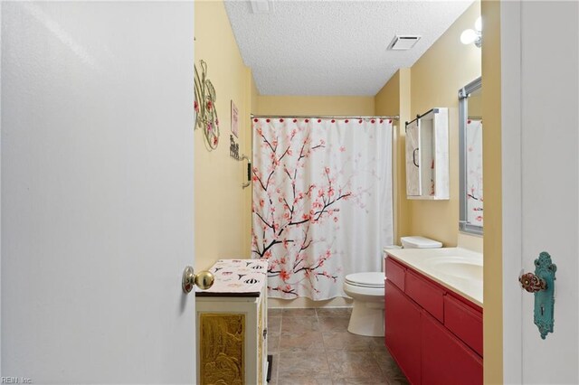 1005 Villas Ct, Virginia Beach, VA 23456 - bathroom with vanity, a textured ceiling, toilet, and a shower with curtain