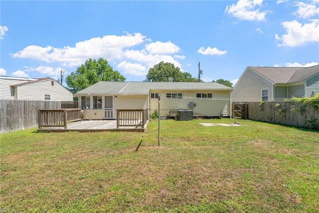 rear view of house featuring a deck and central AC