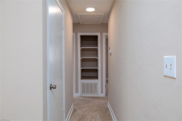 corridor featuring carpet and baseboards