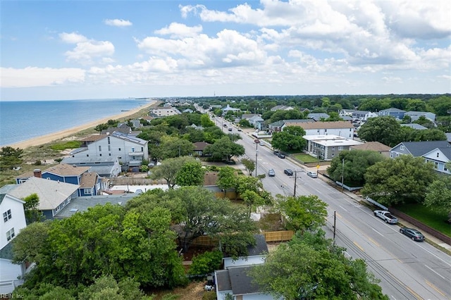 aerial view of residential area with expansive beach