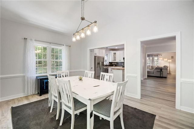 dining space with light wood finished floors