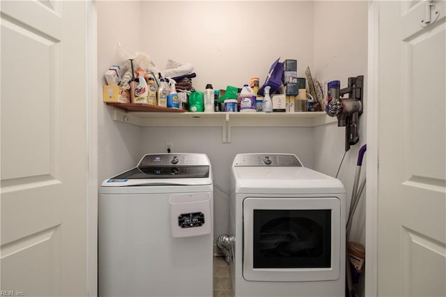 laundry area with independent washer and dryer