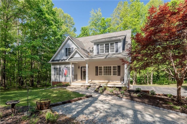 view of front of home featuring a porch and a front yard