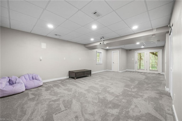 interior space with carpet flooring, baseboards, a drop ceiling, and recessed lighting