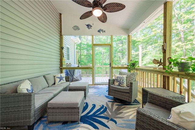 sunroom with an outdoor living space, a ceiling fan, lofted ceiling, and healthy amount of natural light