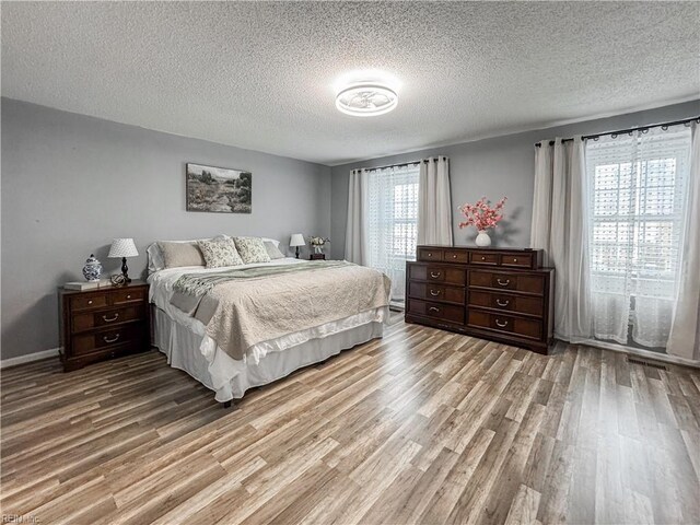 634 Biltmore Dr, Virginia Beach, VA 23454 - bedroom with wood finished floors and a textured ceiling