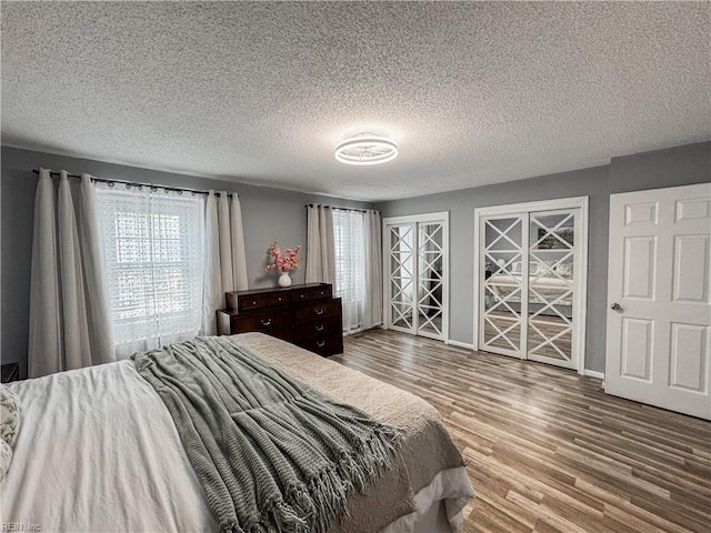 634 Biltmore Dr, Virginia Beach, VA 23454 - bedroom featuring wood finished floors, a textured ceiling, and baseboards