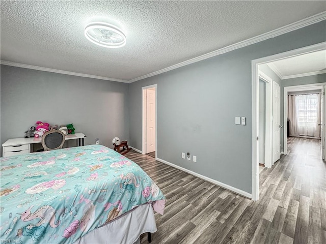 634 Biltmore Dr, Virginia Beach, VA 23454 - bedroom with wood finished floors, a textured ceiling, ornamental molding, and baseboards