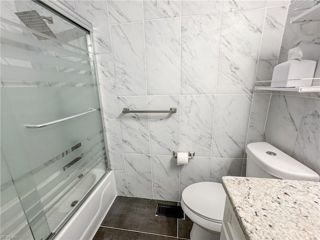 634 Biltmore Dr, Virginia Beach, VA 23454 - full bathroom featuring toilet, shower / bath combination with glass door, tile walls, and vanity