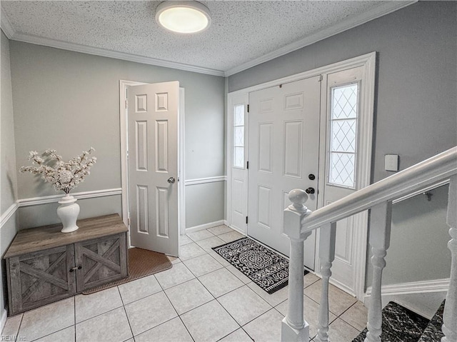 634 Biltmore Dr, Virginia Beach, VA 23454 - foyer entrance featuring light tile patterned floors, a textured ceiling, and ornamental molding
