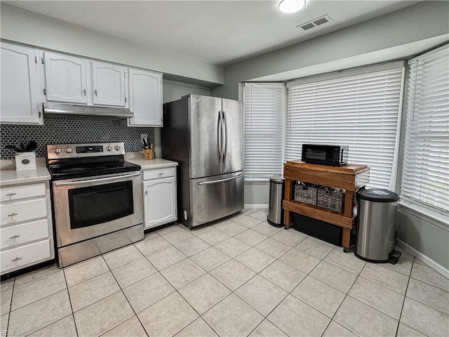 634 Biltmore Dr, Virginia Beach, VA 23454 - kitchen featuring appliances with stainless steel finishes, under cabinet range hood, light countertops, and light tile patterned floors