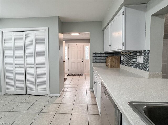 634 Biltmore Dr, Virginia Beach, VA 23454 - kitchen with dishwasher, light countertops, light tile patterned floors, and white cabinetry