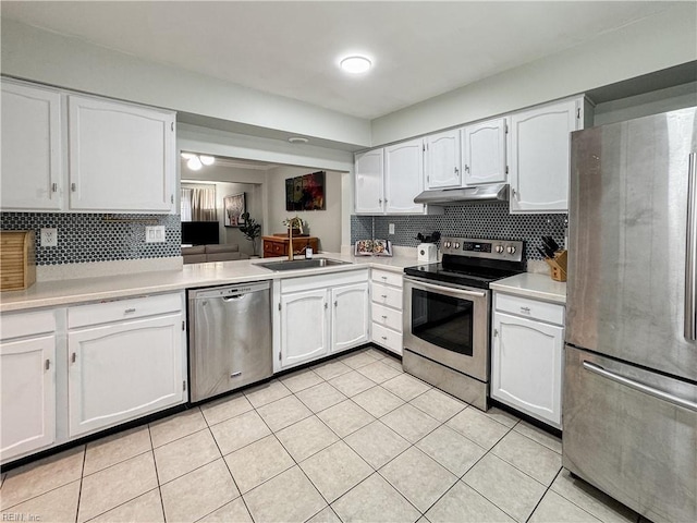 634 Biltmore Dr, Virginia Beach, VA 23454 - kitchen with appliances with stainless steel finishes, a sink, light tile patterned flooring, white cabinets, and light countertops