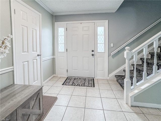 634 Biltmore Dr, Virginia Beach, VA 23454 - entrance foyer featuring light tile patterned floors, stairway, a textured ceiling, baseboards, and ornamental molding