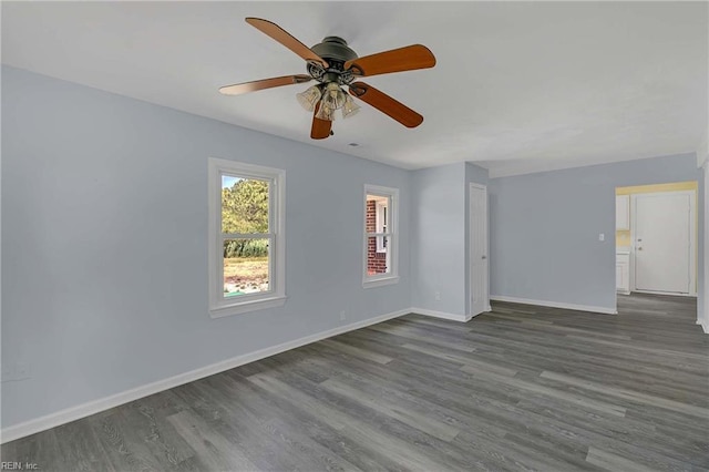 2111 Jenkins Neck Rd, Hayes, VA 23072 - unfurnished room featuring dark wood-type flooring, baseboards, and ceiling fan