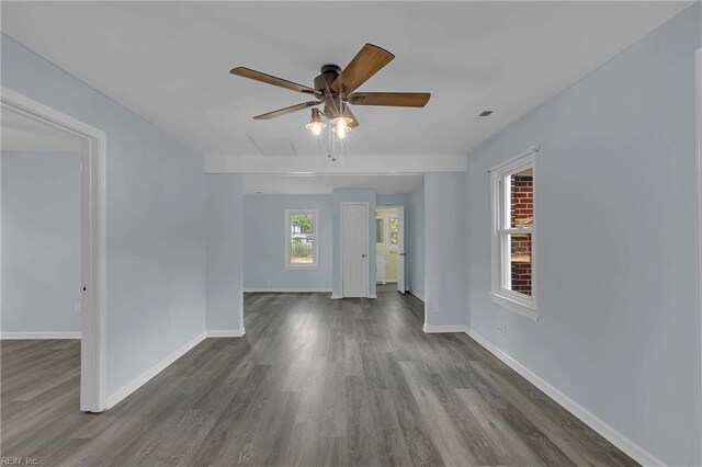 2111 Jenkins Neck Rd, Hayes, VA 23072 - unfurnished room featuring dark wood-type flooring, a ceiling fan, and baseboards