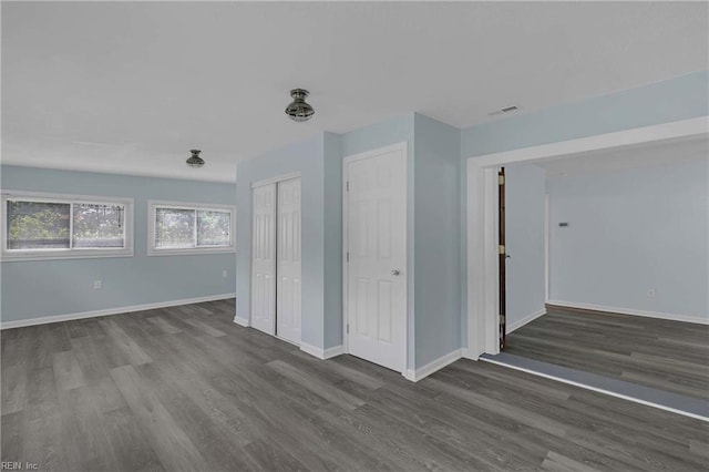 2111 Jenkins Neck Rd, Hayes, VA 23072 - spare room featuring dark wood-type flooring and baseboards