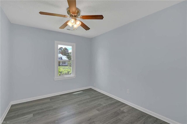 2111 Jenkins Neck Rd, Hayes, VA 23072 - spare room featuring baseboards, dark wood-style flooring, and ceiling fan