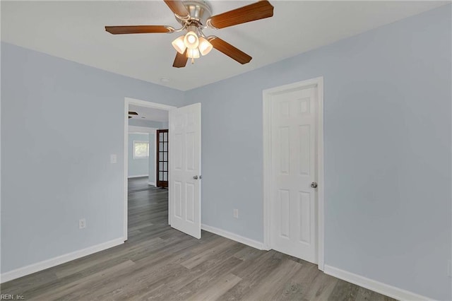 2111 Jenkins Neck Rd, Hayes, VA 23072 - empty room featuring baseboards, wood finished floors, and ceiling fan