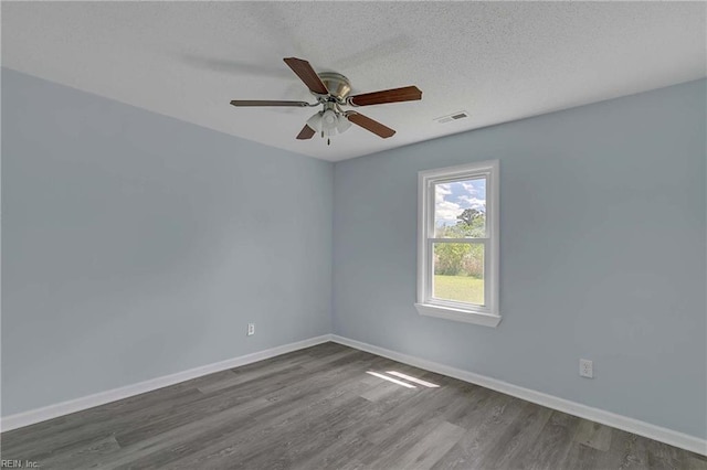 2111 Jenkins Neck Rd, Hayes, VA 23072 - spare room featuring ceiling fan, baseboards, and dark wood-style flooring
