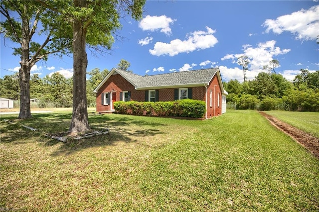2111 Jenkins Neck Rd, Hayes, VA 23072 - ranch-style home featuring brick siding and a front lawn