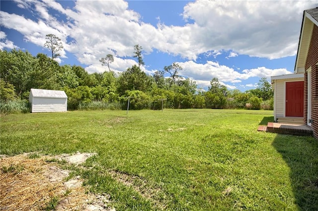 2111 Jenkins Neck Rd, Hayes, VA 23072 - view of green lawn featuring a shed and an outdoor structure