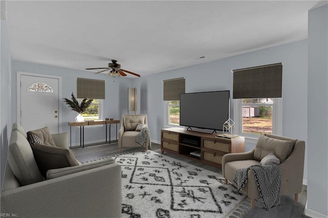 2111 Jenkins Neck Rd, Hayes, VA 23072 - living room featuring wood finished floors, ceiling fan, and baseboards