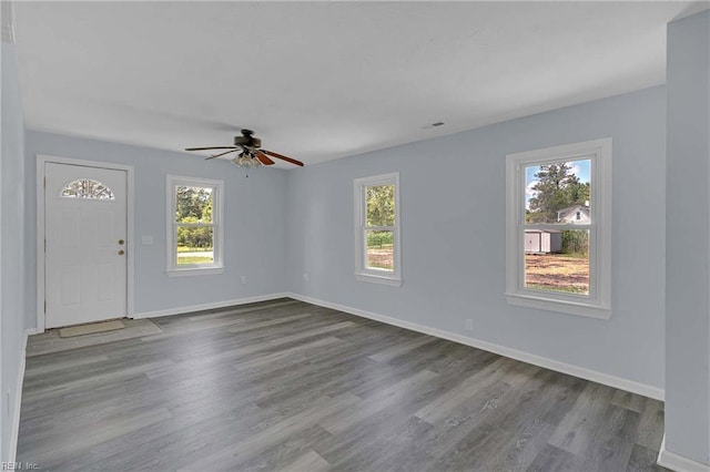 2111 Jenkins Neck Rd, Hayes, VA 23072 - foyer entrance with plenty of natural light, dark wood-style flooring, ceiling fan, and baseboards