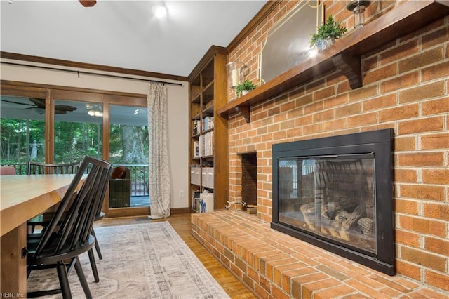 6 Hastings Ln, Williamsburg, VA 23188 - living area featuring crown molding, a brick fireplace, baseboards, wood finished floors, and ceiling fan
