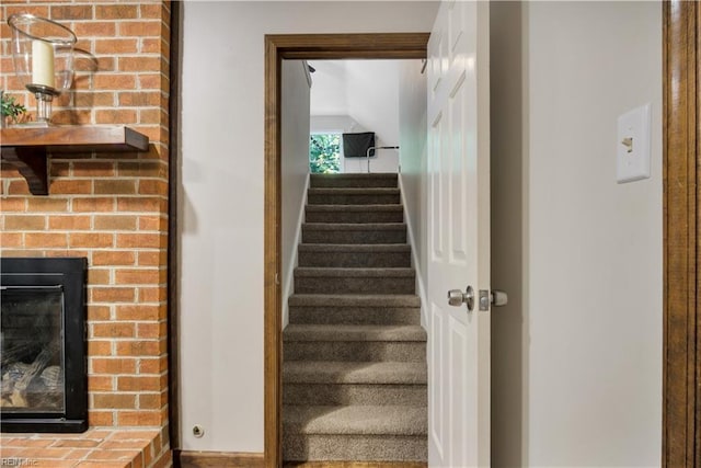 6 Hastings Ln, Williamsburg, VA 23188 - staircase with lofted ceiling and a fireplace