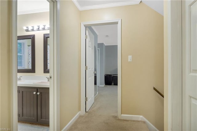 6 Hastings Ln, Williamsburg, VA 23188 - hallway featuring light carpet, ornamental molding, baseboards, an upstairs landing, and a sink